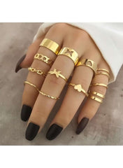 Gold adjustable ring set for women displayed on a hand with various styles and designs