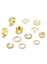 Adjustable gold ring set with heart and star motifs, assorted stackable bands