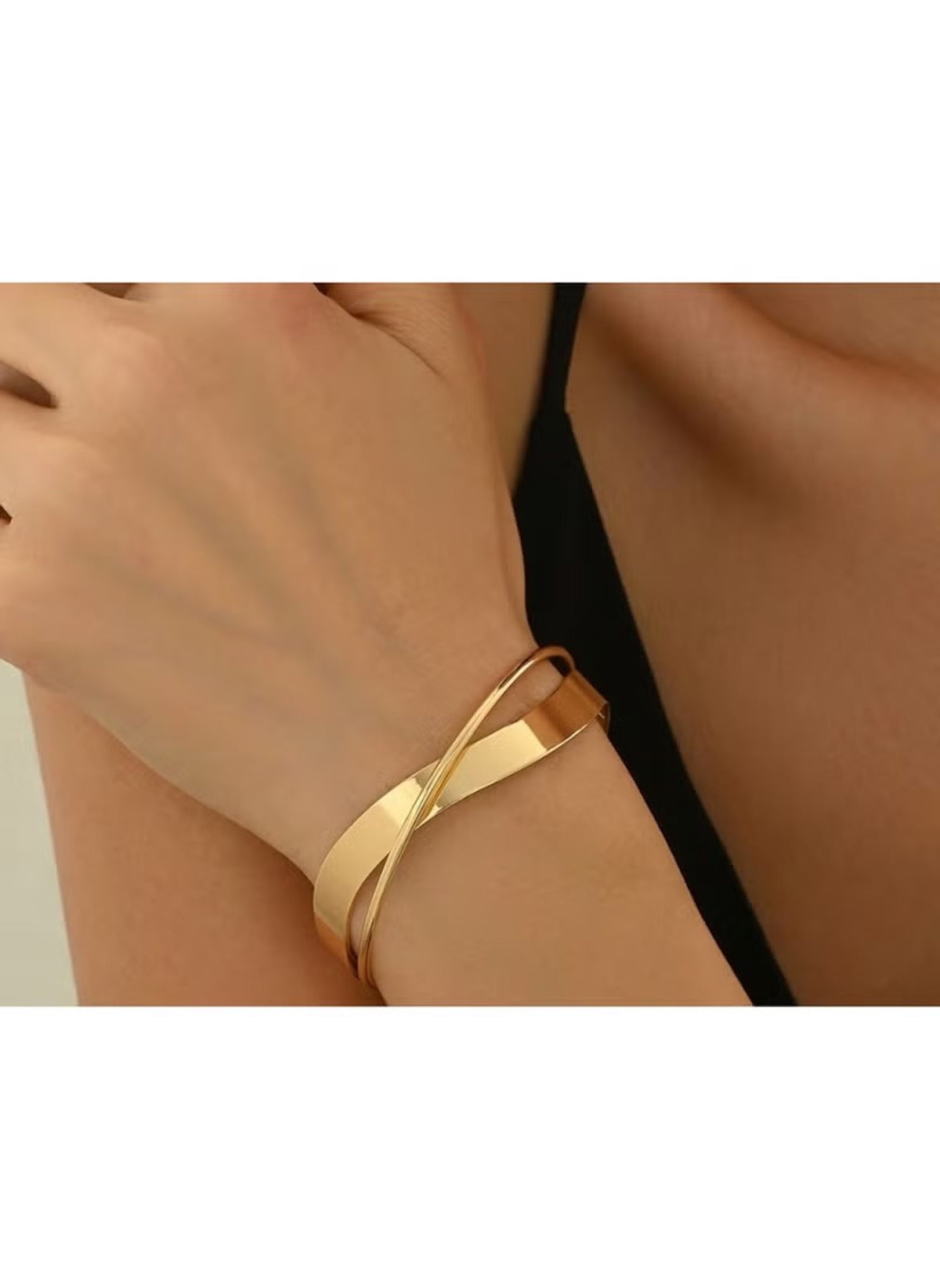 Huitich gold alloy bracelet and ring set worn on wrist with elegant overlapping design