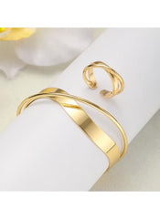 Huitich gold alloy bracelet and ring set with smooth curved design on white display