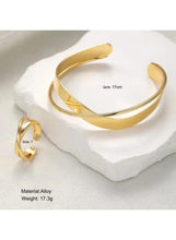Gold alloy cuff bracelet and ring set; ring size 7, weight 17.3g.