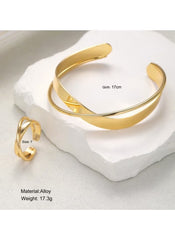 Huitich gold alloy bracelet and ring set displayed on white stone with bracelet girth 17cm and ring size 7