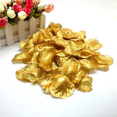 Gold artificial rose petals made of artificial silk by Huitich displayed on a white surface