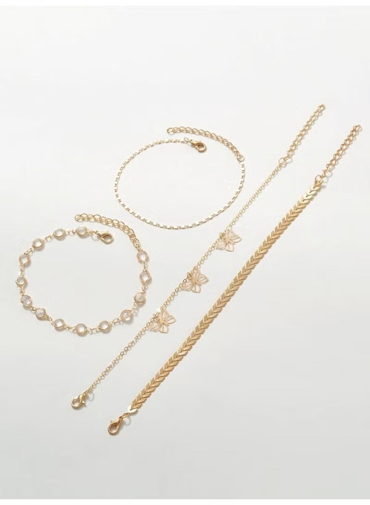 Huitich gold butterfly anklet set featuring delicate chains and butterfly accents for stylish layering