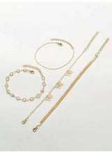 Gold butterfly anklet set with twisted rope, beaded, and chain layers, four anklets