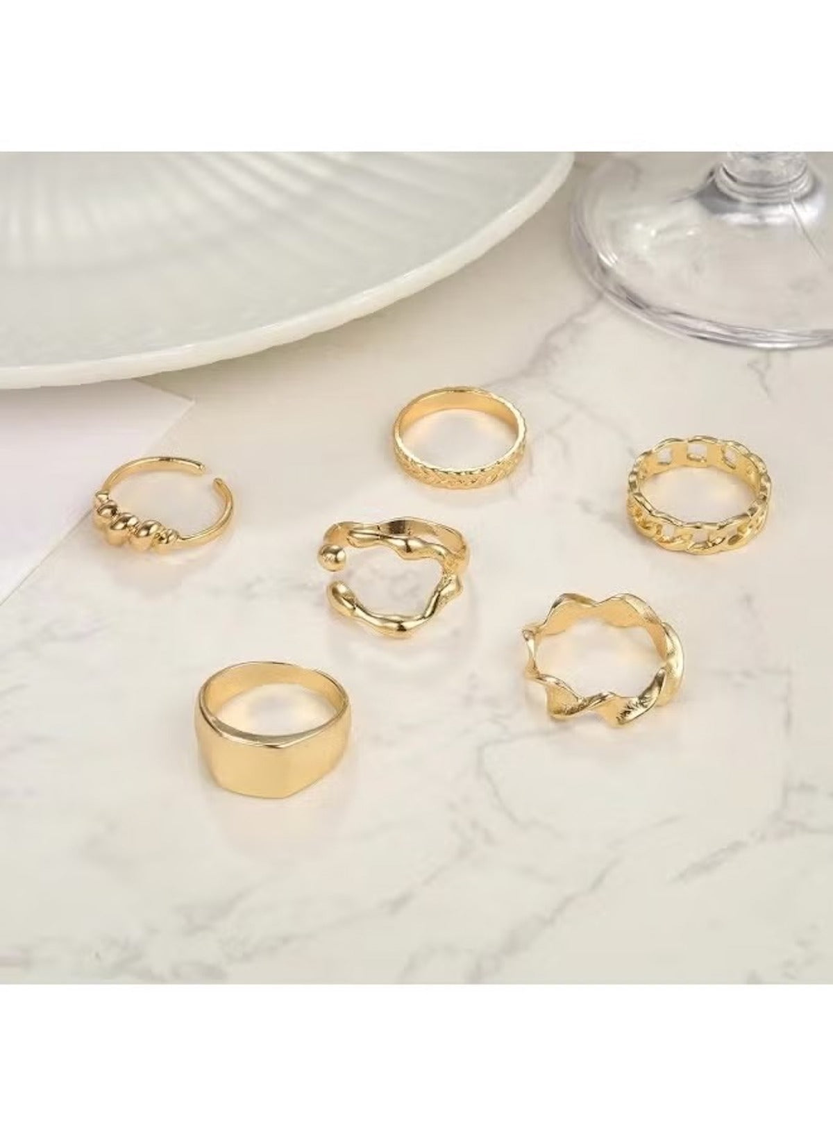 Gold chunky statement ring set featuring various designs for stylish stacking options