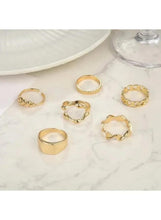 Gold tone chunky statement ring set of five geometric rings on display