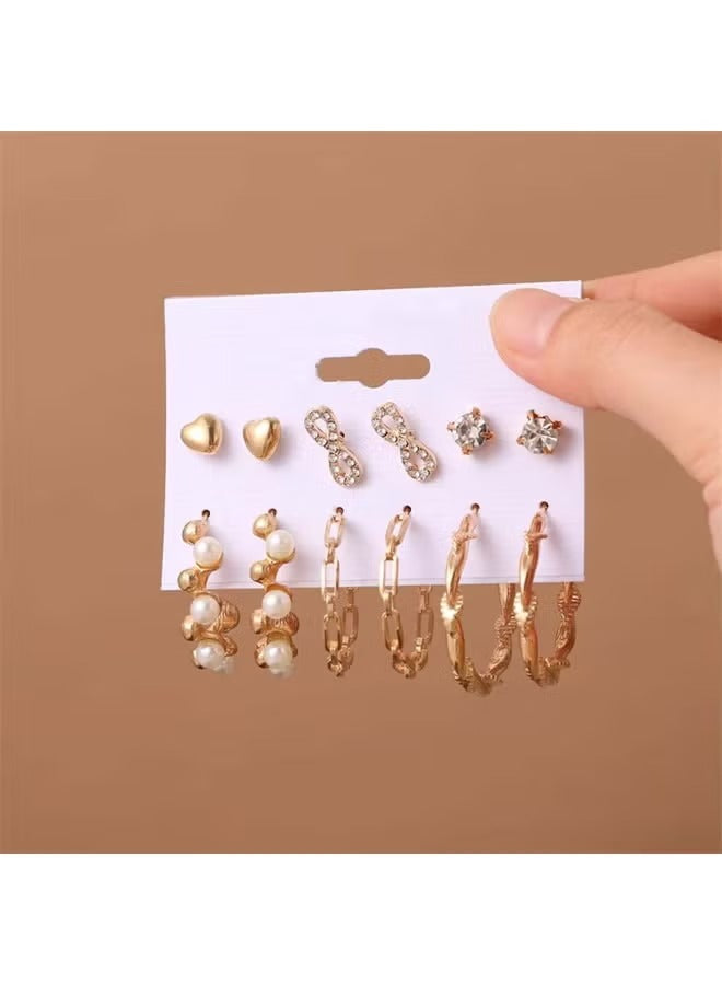Gold earring set for women featuring heart studs, crystal accents, and pearl hoops