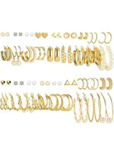 Gold-tone earring set with mixed hoops, pearls, and stud designs, flat lay assortment