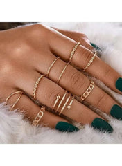 Huitich gold fashion ring set for women featuring assorted styles and elegant designs on a hand with dark green nails