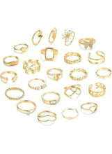 Gold-tone women’s ring set with mixed minimalist and ornate bands