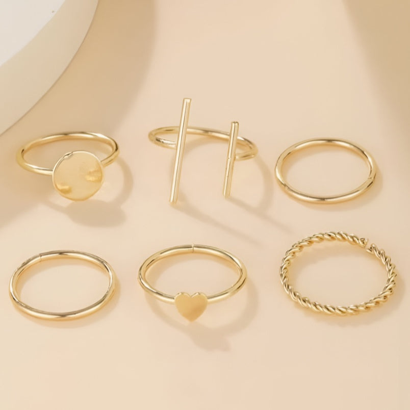Huitich gold fashion rings set featuring six elegant minimalist designs on a beige background