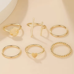 Huitich gold fashion rings set featuring six elegant minimalist designs on a beige background