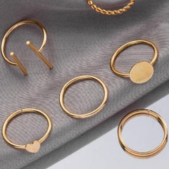 Huitich gold fashion rings set with various minimalist designs on gray fabric background