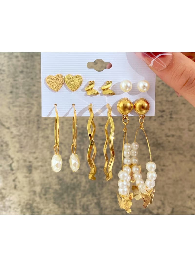 Gold heart and butterfly earring set with various styles including hoops and studs