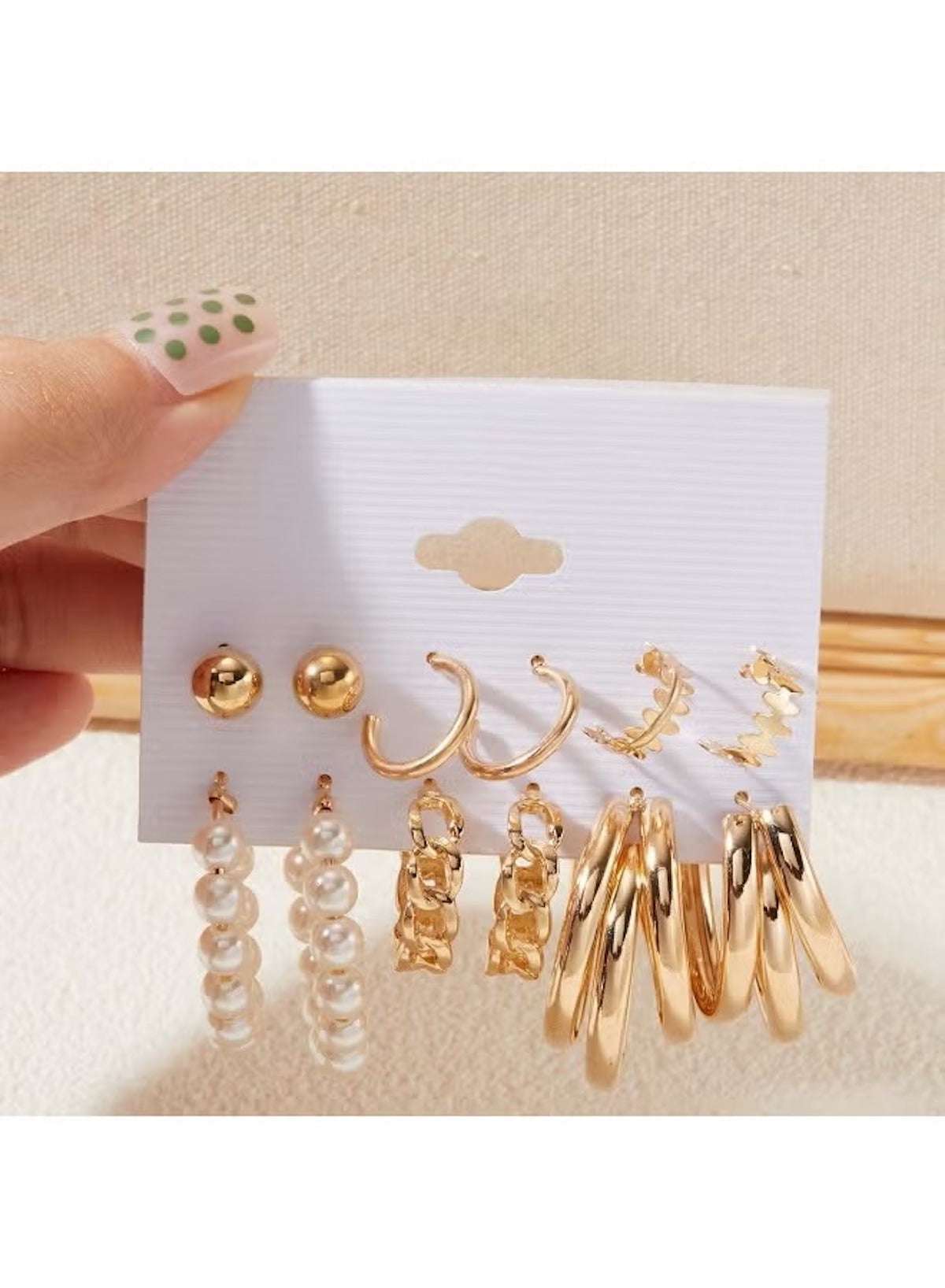 Gold hoop and pearl stud earring set for women featuring various styles including dangling and stud earrings