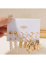 Gold and pearl earring set with round studs, small hoops, and pearl drop dangles