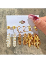 Gold and pearl earring set with hoop pairs, pearl drops, and round stud backs
