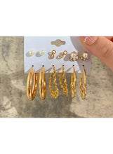 Gold hoop and stud earring set with faux pearl studs and linked hoops, held on card