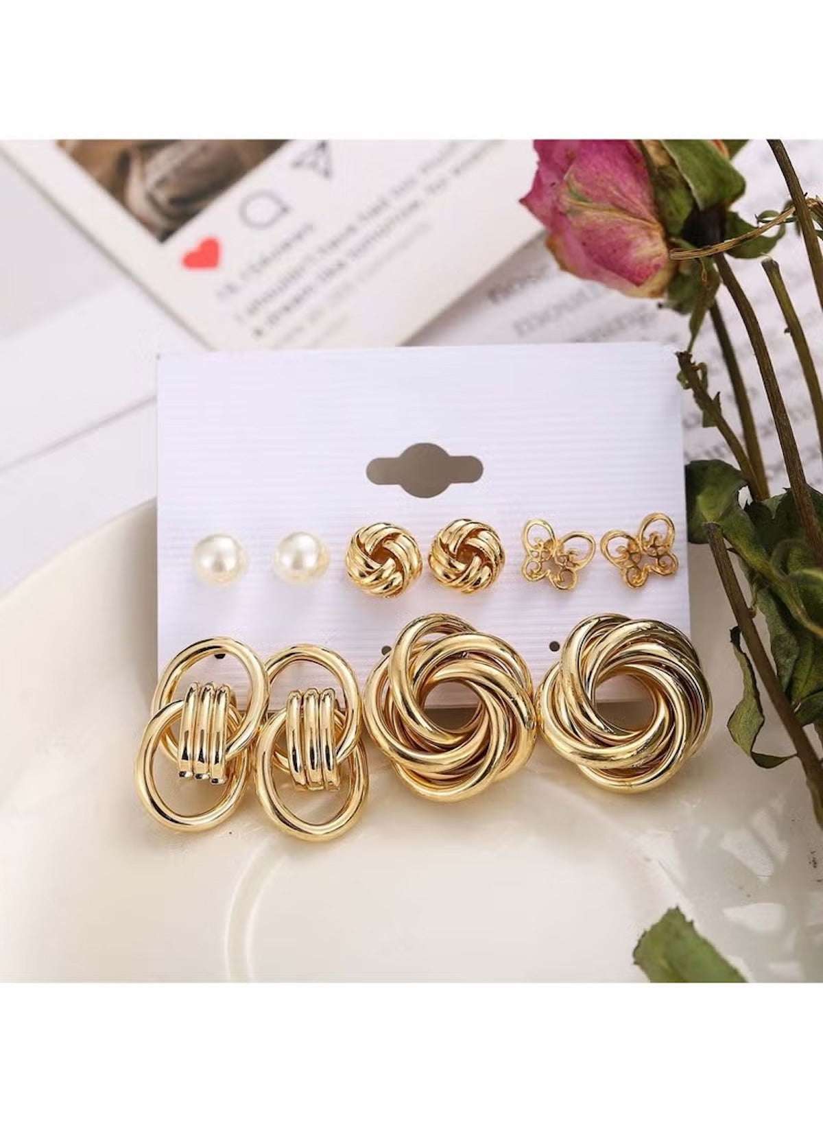 Gold knot and pearl stud earring set featuring various designs and textures for versatile styling