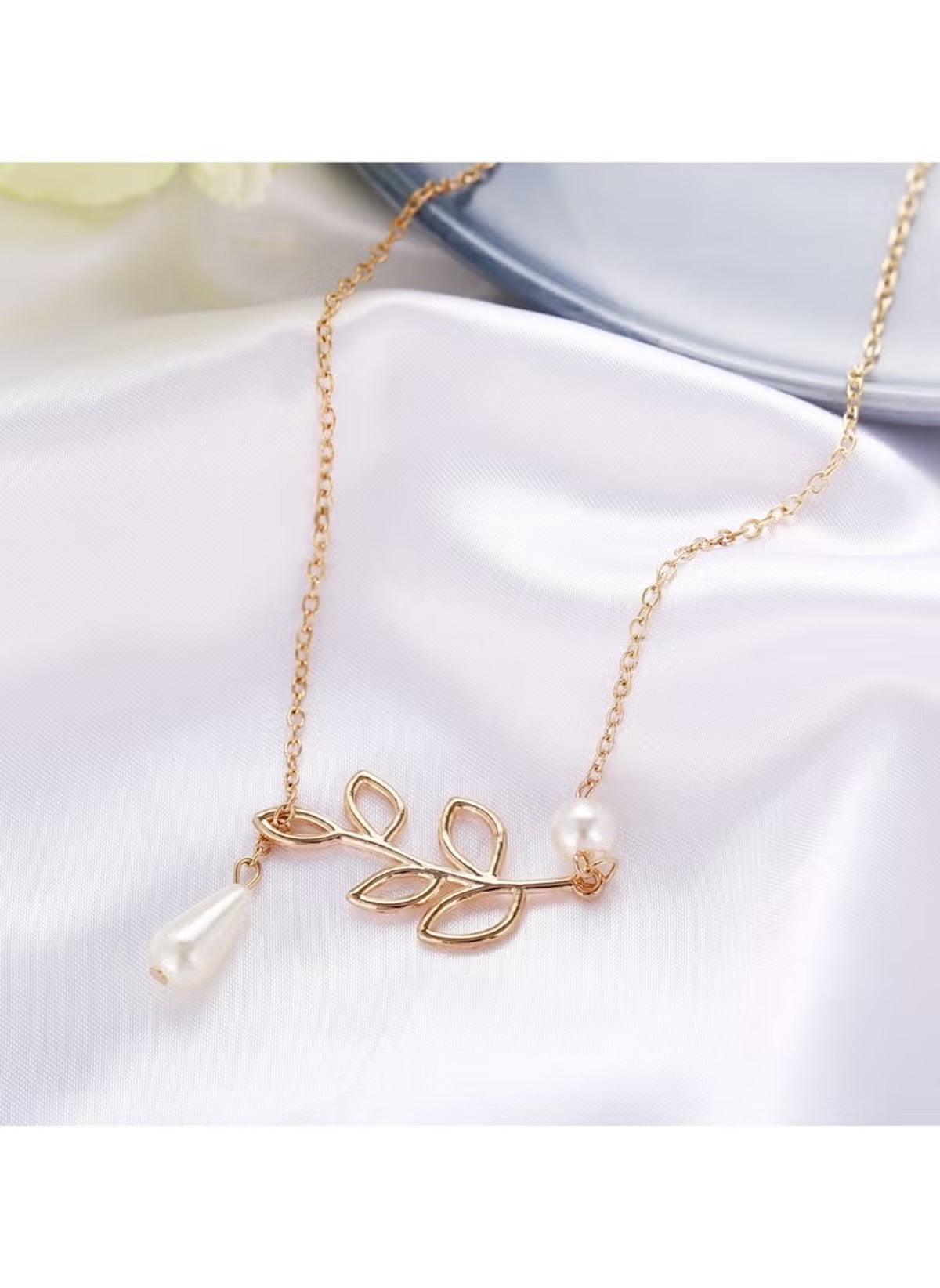 Huitich gold leaf pearl necklace featuring delicate gold leaf design and pearl accents on a fine chain