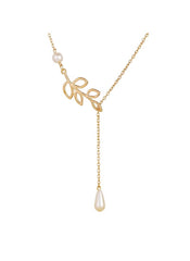 Huitich gold leaf pearl necklace with delicate gold chain and pearl accents on white background