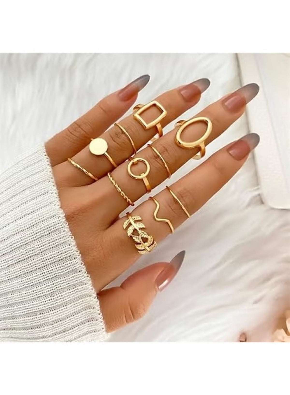 Huitich gold minimalist ring set for women displayed on a model's hand with various elegant designs