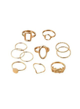 Gold-tone geometric ring set with square, oval, and stacked band designs (11 pieces).