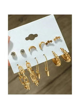 Gold-tone chain-link, moon, and star stud and drop earrings on display card