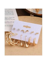 Gold-tone earring set with moon and star studs, small crystal studs, on card
