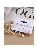 Gold-tone moon and star hoop studs and chain-link drop earrings set on card