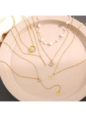Huitich gold necklace set for women featuring layered chains with different charms and beads