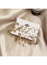 Gold-tone earring set with pearl hoops, crystal studs, and dangling drop earrings