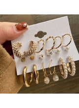 Gold-tone pearl and crystal earring set on card with hoops and dangling studs
