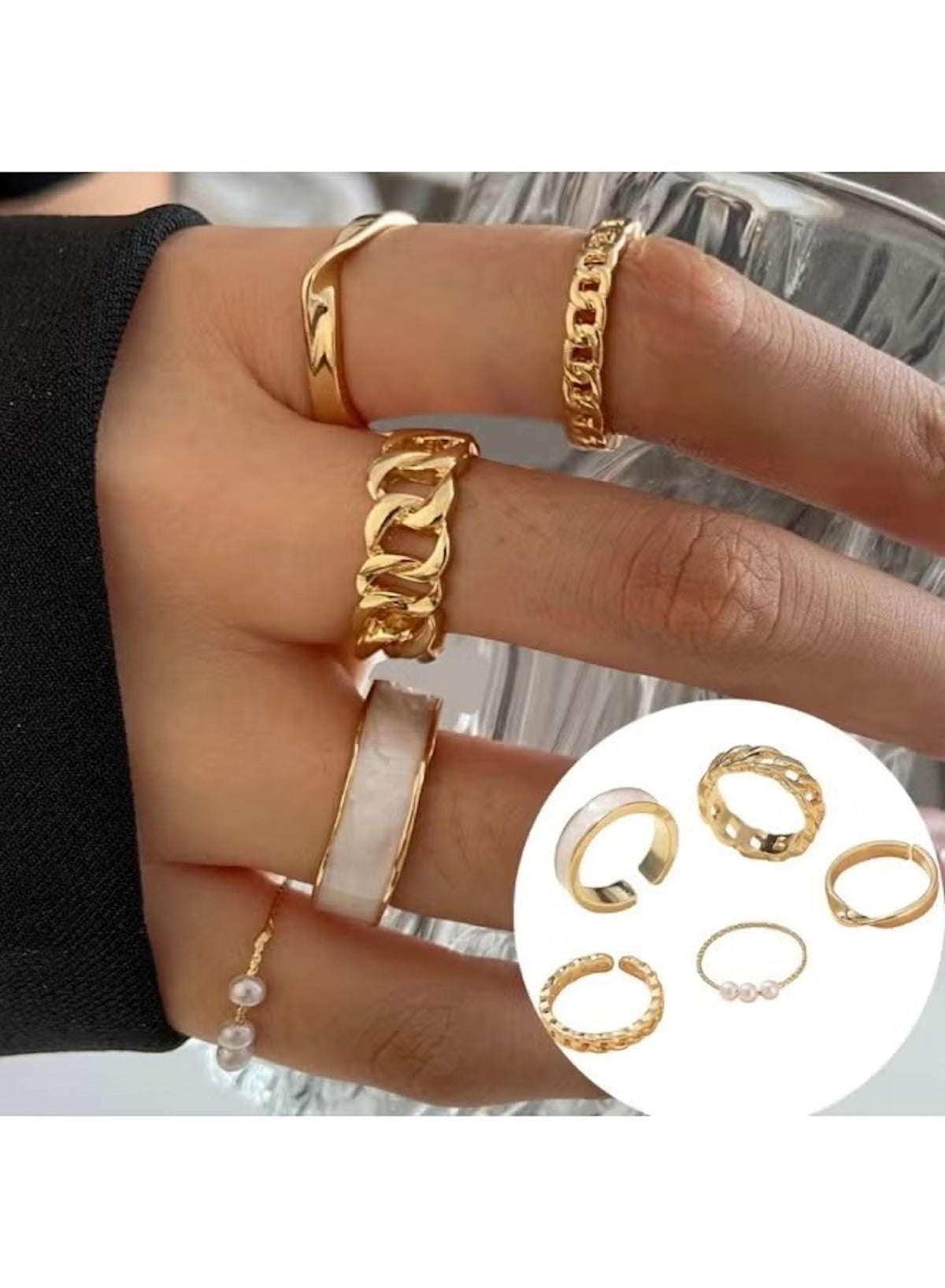 Gold plated pearl ring set featuring multiple stylish bands on a hand for elegant accessorizing