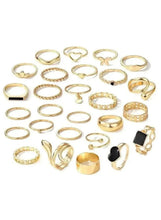 Gold-tone mixed fashion ring set, assorted designs and stones on display