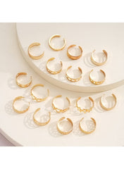 Elegant gold ring set for women featuring various intricate designs and textures