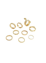 Gold snake & chain-style ring set: nine stacked textured and linked bands