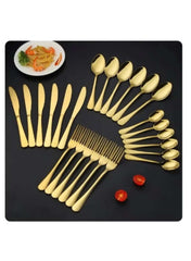 Huitich gold stainless steel cutlery set with knives forks and spoons displayed on black surface
