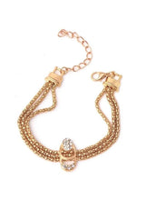 Gold-tone crystal chain bracelet with heart charm and clip stud earrings