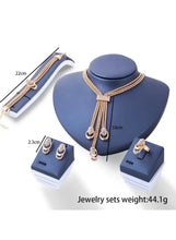 Gold-tone crystal Y necklace, bracelet, earrings, and ring set; 44.1g weight