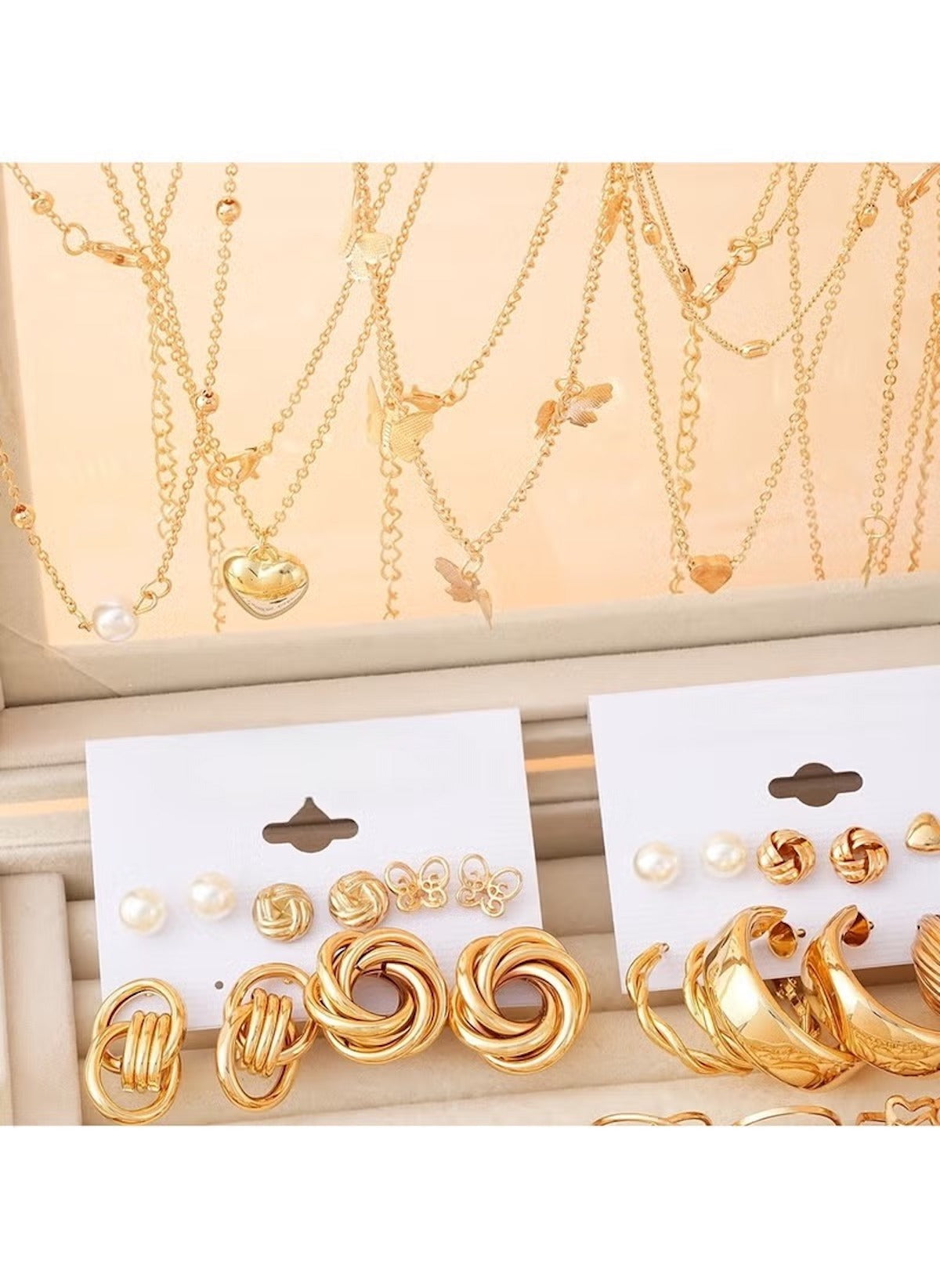 Huitich gold tone jewelry set with layered necklaces and assorted earrings including hoops and studs