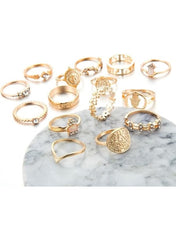 Gold vintage boho ring set for women displayed on a marble surface with various unique designs
