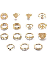 Gold-tone boho ring set with mixed designs, laid out flat