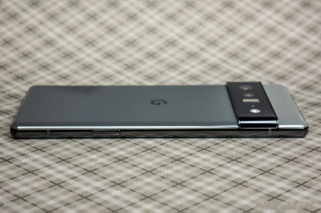Google Pixel 6 Pro 5G unlocked sleek gray smartphone lying face down showing rear camera bar and G logo