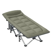 Folding camping cot with green cushioned fabric mattress and headrest