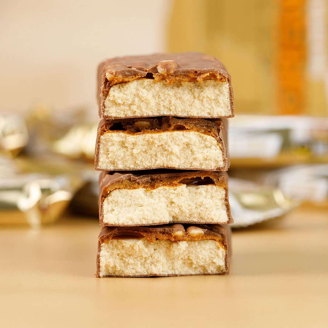 Grenade Carb Killa protein bar stacked chocolate coated halves showing airy vanilla nougat filling and crunchy topping