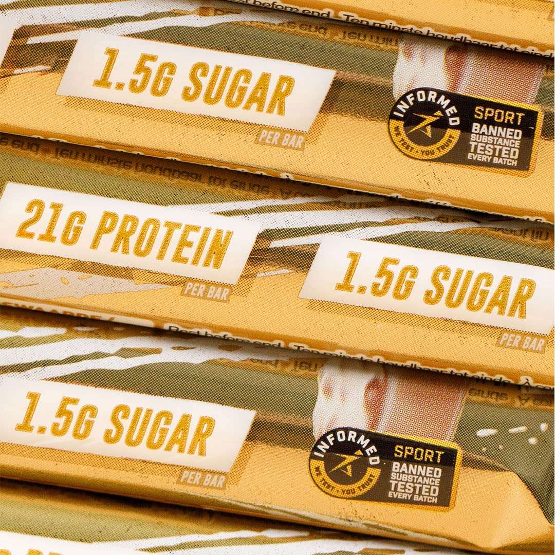 Stack of Grenade Carb Killa protein bar packages showing 21g protein 1.5g sugar and Informed Sport tested logo