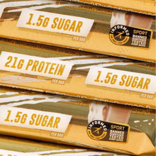 Stacked protein bars showing 1.5g sugar and 21g protein text on wrappers