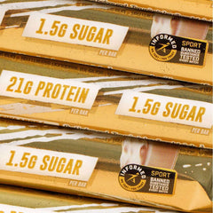 Stack of Grenade Carb Killa protein bar packages showing 21g protein 1.5g sugar and Informed Sport tested logo